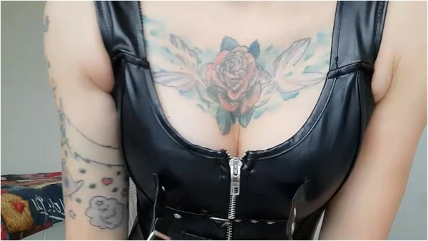 DOMINATRIX NIKA - A Dominatrix In A Leather Corset Teases You With Her Boobs